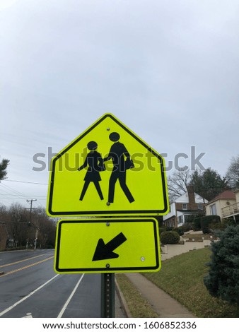 Pedestrian Crossing sign neon yellow with arrow
