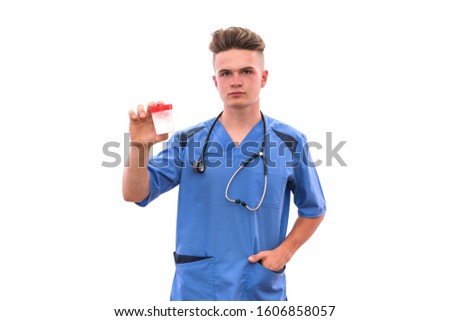 Doctor holding bottle with pills isolated on white background
