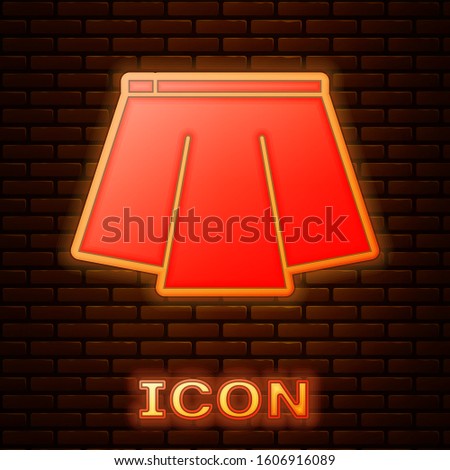 Glowing neon Skirt icon isolated on brick wall background.  Vector Illustration