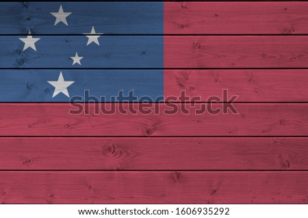 Samoa flag depicted in bright paint colors on old wooden wall. Textured banner on rough background