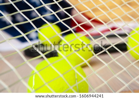 Tennis equipment on wooden surface close up