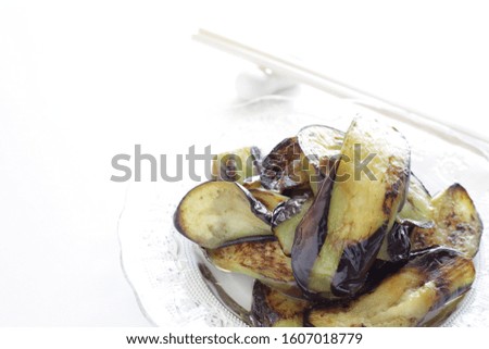 Chinese food, deep fried eggplant on glass plate 