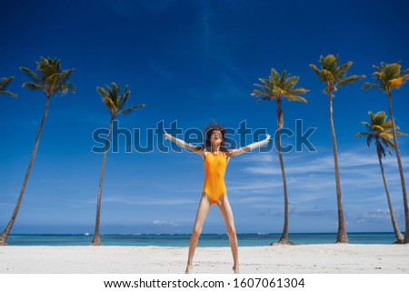 Woman in yellow swimsuit beach vacation summer travel