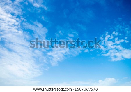 Blue sky background and white clouds soft focus, and open space.