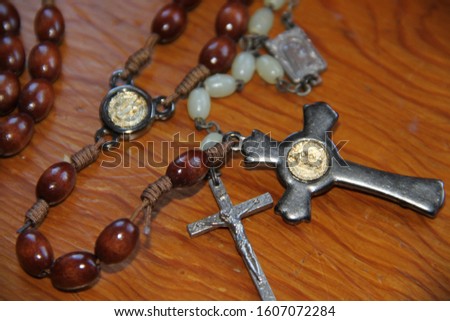 Necklace devotion to god wood background