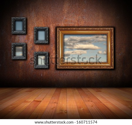 architectural interior  backdrop with wooden frames on grunge wall 