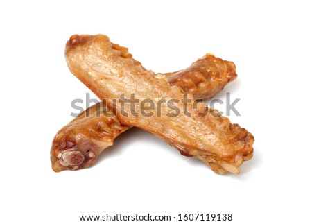 Cooked duck wings on a white background