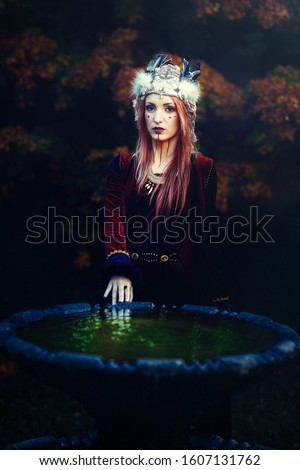 beautiful shamanic woman with headband in the nature.