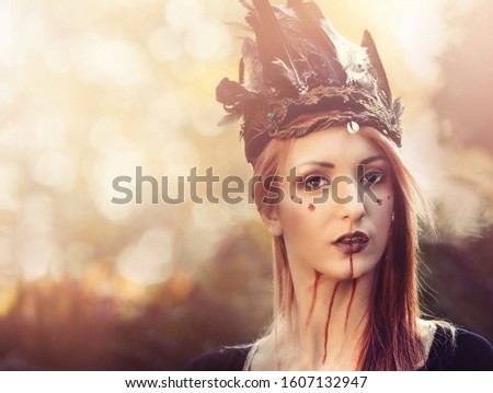 beautiful shamanic woman with headband in the nature.