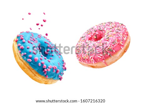Fresh sweet donuts in motion with multicolored fruit glaze and sprinkles decorated. Fast sweet food concept, bakery ad design elements with glazed frosted falling doughnuts isolated, white background Royalty-Free Stock Photo #1607216320