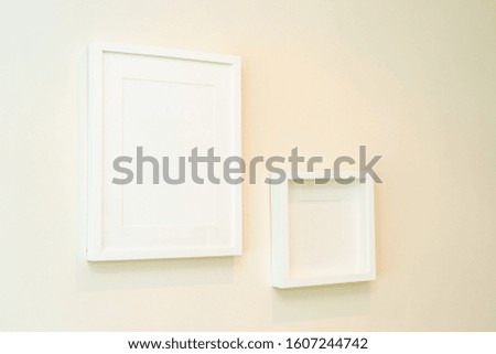 Empty photo frame on wall decoration interior of room