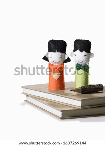 The concept of finger dolls, good children, friends children's education on a book