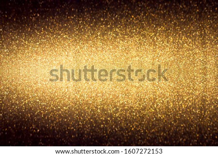 Golden background. Abstract twinkled bright background with bokeh defocused golden lights.