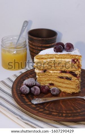 Slice of homemade honey cake , light background