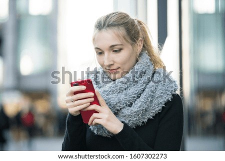 young woman uses smart phone