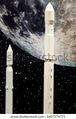 Toy space launch vehicle. You can see the details. The background is blurred. Old-generation missiles.