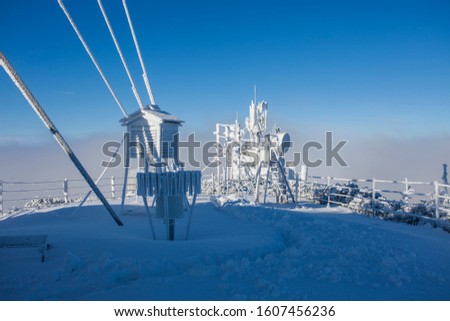 weather station in winter landscape. Ceahlau, Romania Royalty-Free Stock Photo #1607456236