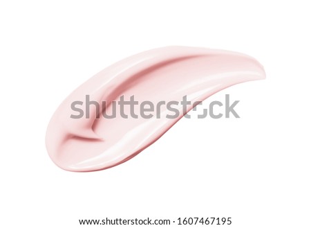 Pink cosmetic cream smear isolated on white background. Peach color beauty creme swipe. Skincare product creamy texture. Color corrector smudge swatch
