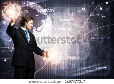 Innovation technology in modern corporate business. Businessman touching virtual interface with financial analytics. World economy trends concept. Forex market statistics and online stock trading.