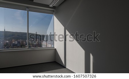 empty office with white walls and window
