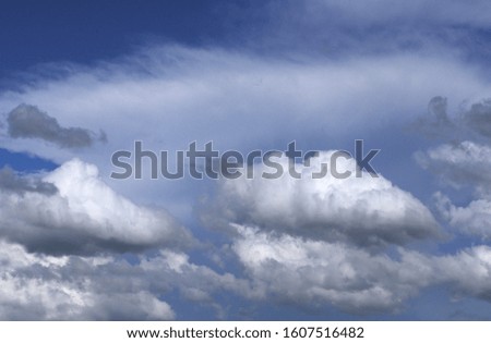 Cumulus clouds on a background of Cirrus clouds