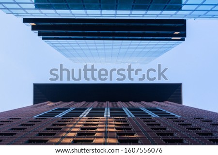 Two high buildings. Up view in financial district of Frankfurt on Main in Germany