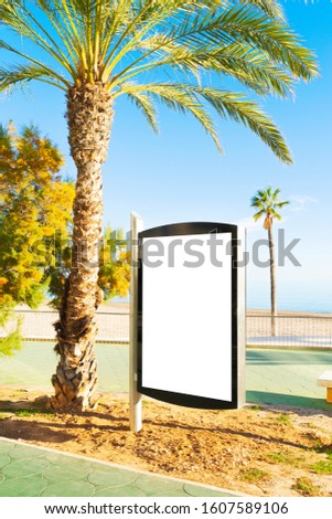 Blank billboard outdoors, outdoor advertising, public information placeholder board near city beach by the sea