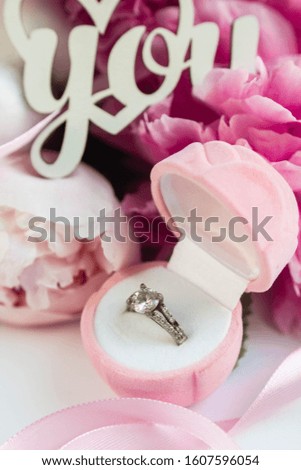 peony, ring box and love you. valentines day background. proposal 
