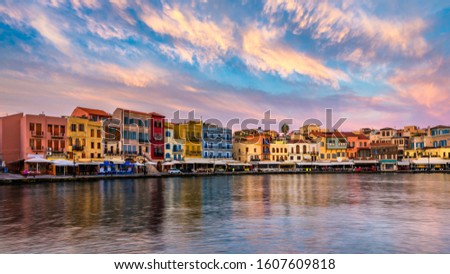 Venetian Harbour of the city of Chania at sunrise with turquoise water, Crete, Greece. View of the old port of Chania on Crete, Greece. Chania, Crete, Greece. View of the old port of Chania on Crete. Royalty-Free Stock Photo #1607609818