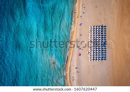 Aerial shot of beautiful turquoise beach Falasarna (Falassarna) in Crete, Greece. View of famous paradise sandy deep turquoise beach of Falasarna (Falassarna) in North West, Crete island, Greece. Royalty-Free Stock Photo #1607620447