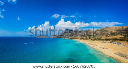Aerial shot of beautiful turquoise beach Falasarna (Falassarna) in Crete, Greece. View of famous paradise sandy deep turquoise beach of Falasarna (Falassarna) in North West, Crete island, Greece. Royalty-Free Stock Photo #1607620705