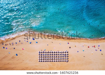 Aerial shot of beautiful turquoise beach Falasarna (Falassarna) in Crete, Greece. View of famous paradise sandy deep turquoise beach of Falasarna (Falassarna) in North West, Crete island, Greece. Royalty-Free Stock Photo #1607621236