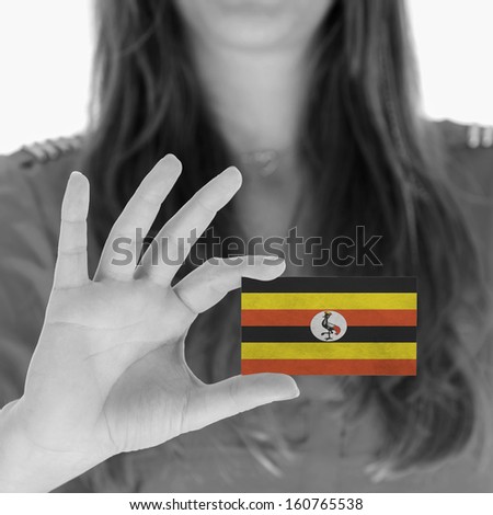 Woman in showing a business card, Uganda