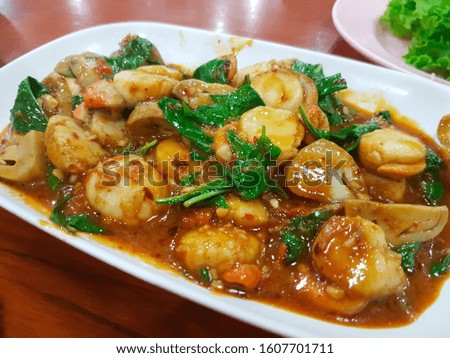 Stir fried scallops with red curry Royalty-Free Stock Photo #1607701711