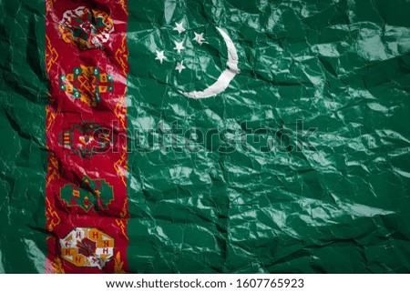 National flag of Turkmenistan
 on crumpled paper. Flag printed on a sheet. Flag image for design on flyers, advertising.