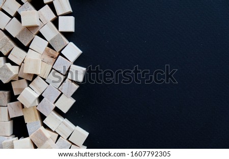 Selective focus Abstract concept of wooden cubes toy isolated on black background, Wooden toy cubes.