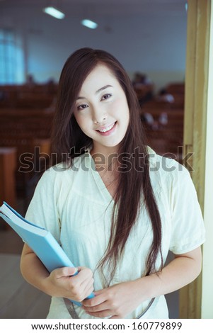 Chinese female college student in the school