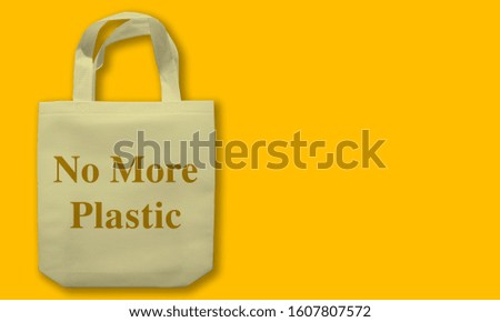 Grocery Bag on Amber Color Background "No More Plastic"
