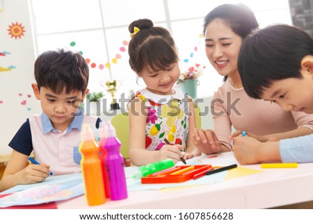 Kindergarten teachers and the children Royalty-Free Stock Photo #1607856628