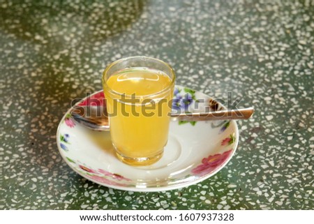 A picture of fresh Mekong honey lemon tea on stone table.