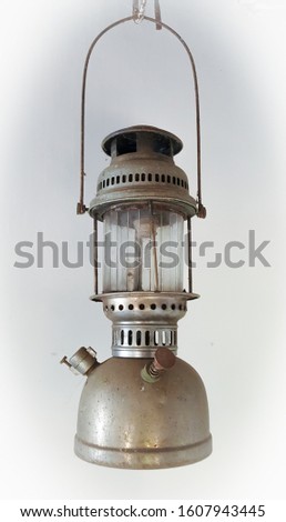 vintage petromax lantern hanging in white background, old antique collection
