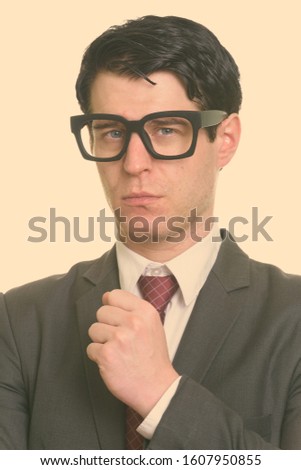 Face of handsome nerd businessman wearing eyeglasses