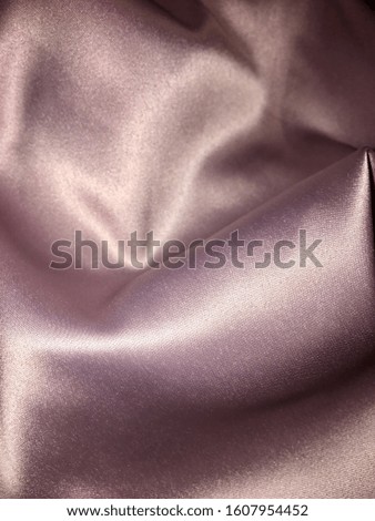 Elegant smooth texture of pink pearl silk fabric, place for text.