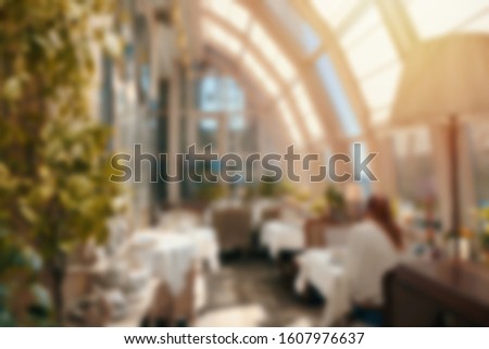 Blur background luxury cafe or restaurant  interior with vintage style tone 