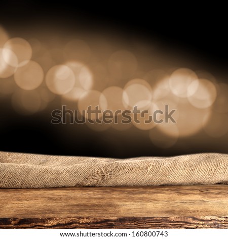 empty brown wooden desk and black background 