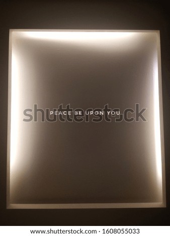 light box with dark and bright background with caption peace be upon you