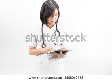 Young asian nurse with a stethoscope using a digital tablet, isolated over white background.