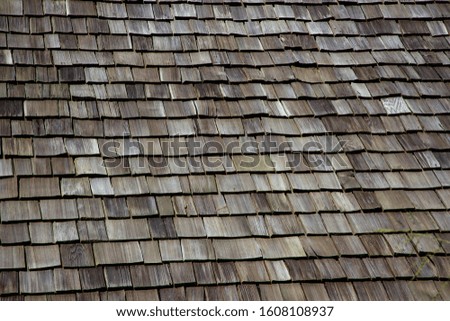 Old​ wooden roof shingles of​ a​ house.​ Abstract​ background. Seamless pattern.