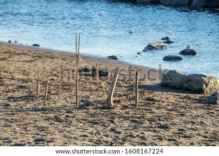 fortress of sticks by the sea built on the sand to play