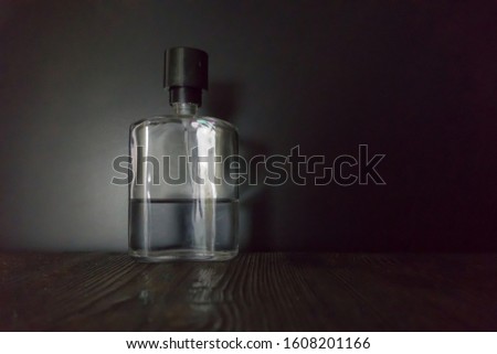 Ad shot of men's perfume on dark background, copy space for your text of logo.